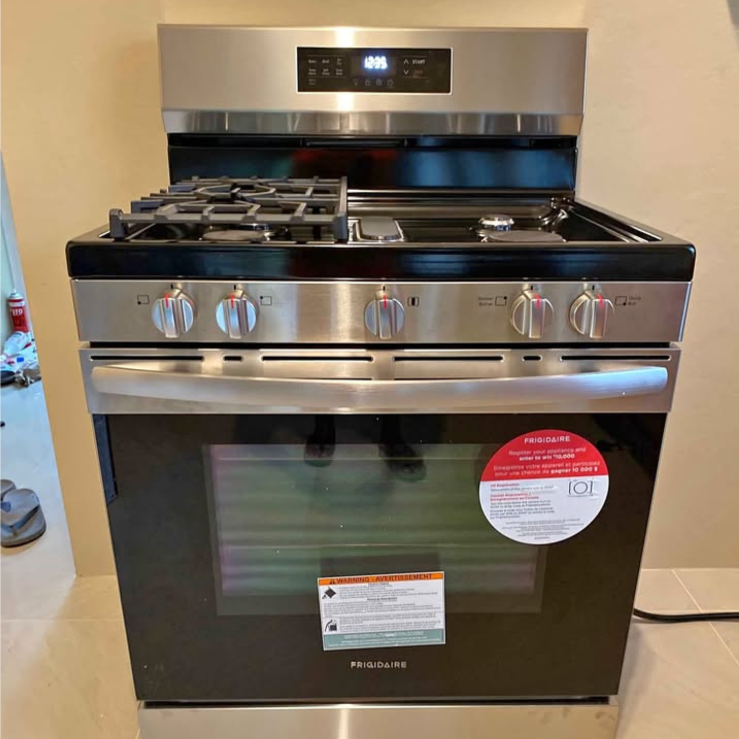 Brand new Frigidaire 5 burner gas range with stainless steel front and digital display