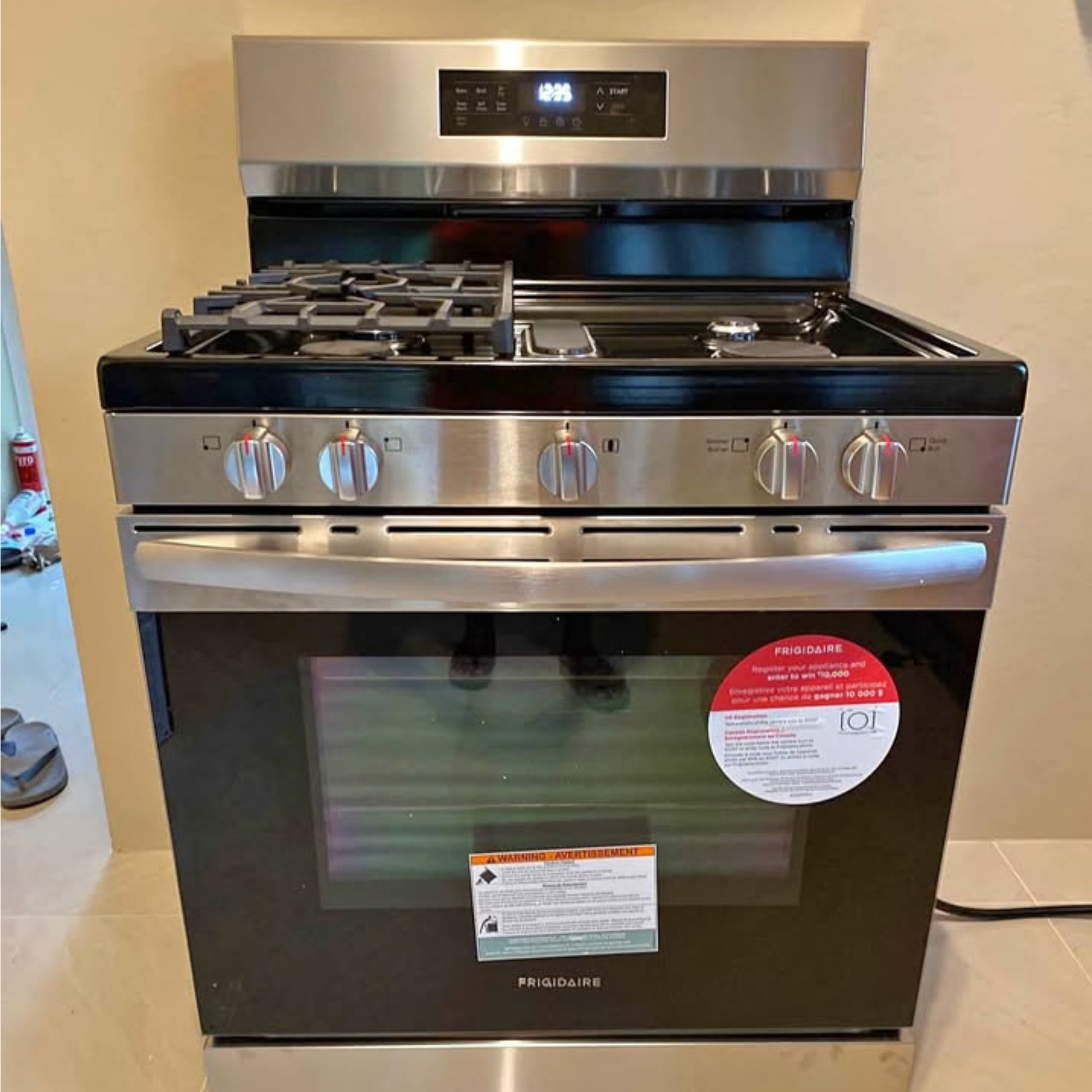 Brand new Frigidaire 5 burner gas range with stainless steel front and digital display